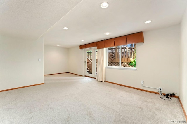 11335 W 54th Ln, Arvada, CO 80002 - spare room with light colored carpet, baseboards, and recessed lighting