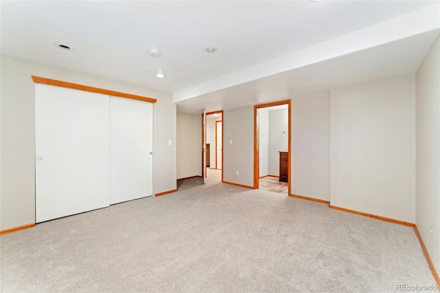 11335 W 54th Ln, Arvada, CO 80002 - unfurnished bedroom featuring light carpet, baseboards, a closet, recessed lighting, and ensuite bath