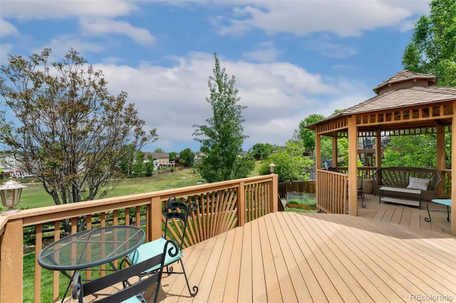 11335 W 54th Ln, Arvada, CO 80002 - wooden deck with a gazebo and outdoor dining space