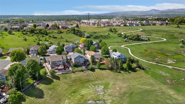 11335 W 54th Ln, Arvada, CO 80002 - aerial view of property and surrounding area featuring a mountainous background and nearby suburban area