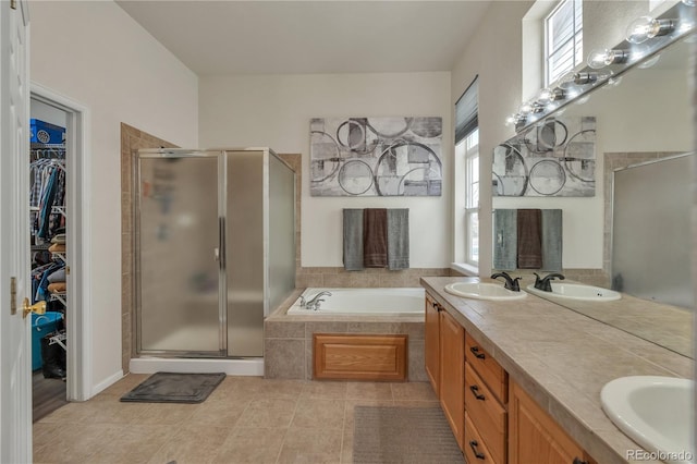 full bath featuring a shower stall and a sink