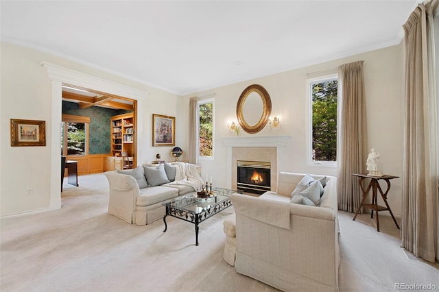 living room with crown molding, a fireplace, and light carpet