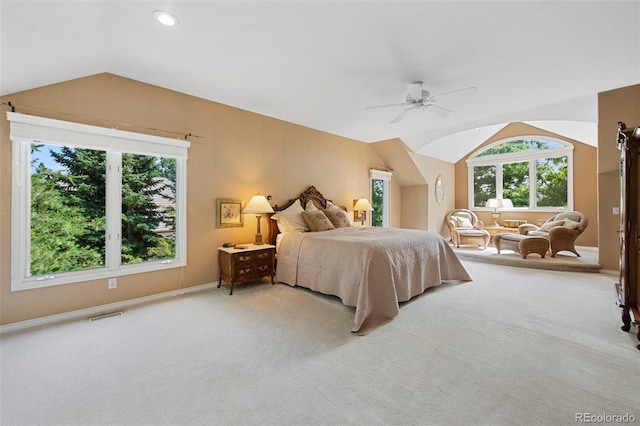 carpeted bedroom featuring ceiling fan and vaulted ceiling