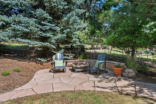 view of patio featuring an outdoor fire pit