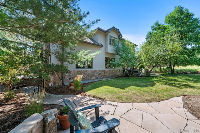 view of yard with a patio area