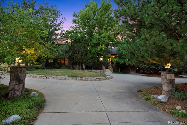 obstructed view of property featuring a lawn