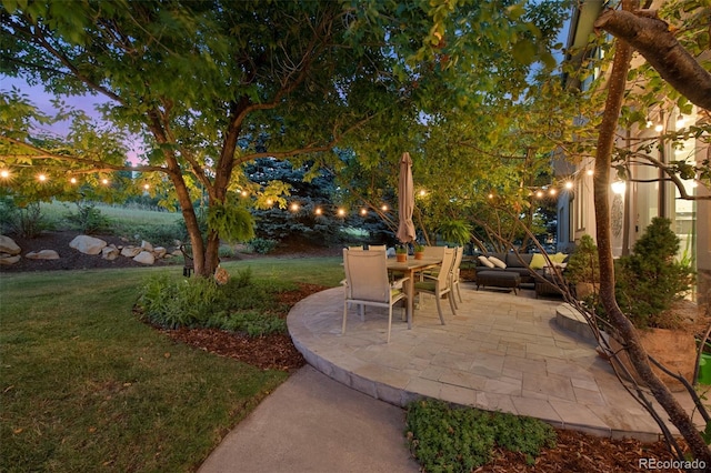 patio terrace at dusk with a lawn