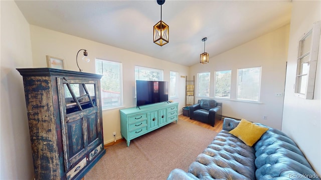 living room featuring a wealth of natural light and lofted ceiling