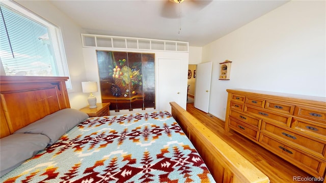 bedroom featuring ceiling fan and light wood-type flooring