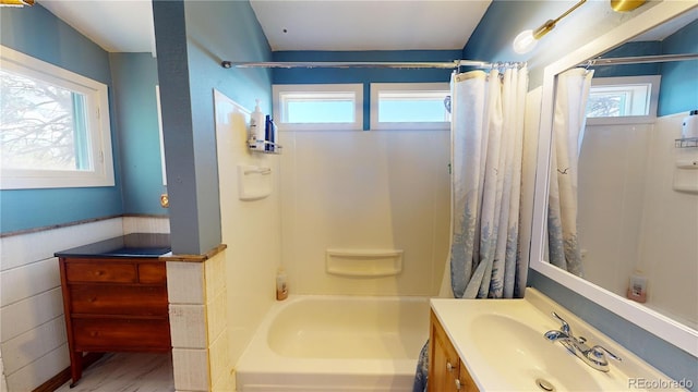 bathroom featuring vanity and shower / bath combo