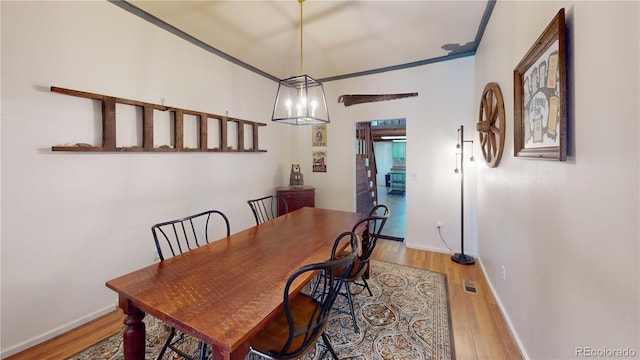 dining space featuring wood-type flooring