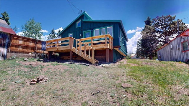 rear view of house with a wooden deck