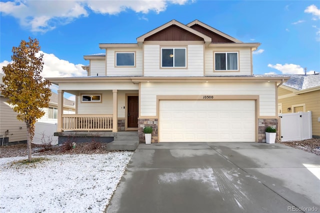 view of front of home featuring a porch and a garage