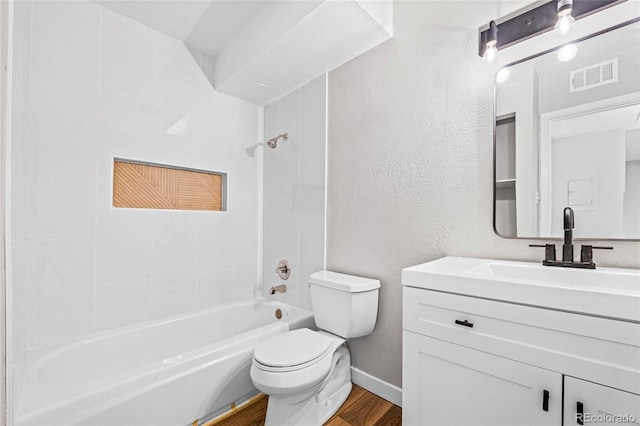3663 S Sheridan Blvd Unit L6, Denver, CO 80235 - bathroom featuring wood finished floors, vanity, bathtub / shower combination, and a textured wall