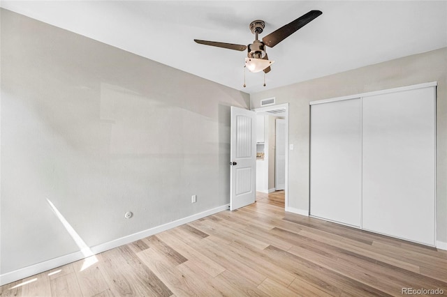 3663 S Sheridan Blvd Unit L6, Denver, CO 80235 - unfurnished bedroom featuring light wood-style floors, a closet, and ceiling fan
