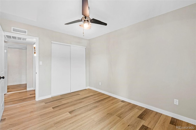 3663 S Sheridan Blvd Unit L6, Denver, CO 80235 - unfurnished bedroom with light wood finished floors, a closet, and ceiling fan
