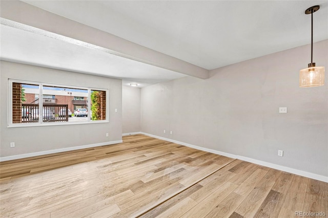 3663 S Sheridan Blvd Unit L6, Denver, CO 80235 - spare room with wood finished floors and baseboards