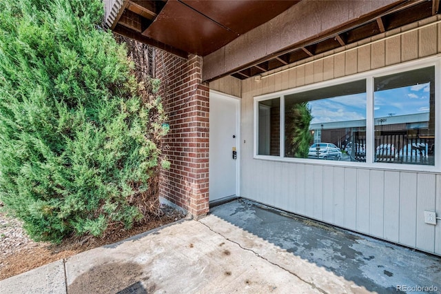 3663 S Sheridan Blvd Unit L6, Denver, CO 80235 - view of exterior entry featuring brick siding