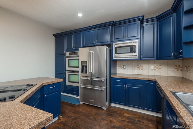 kitchen with dark wood-type flooring, decorative backsplash, stainless steel appliances, blue cabinets, and open shelves