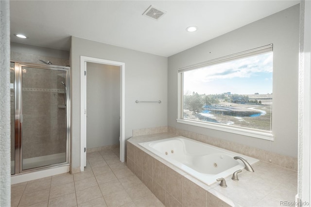 full bathroom with tile patterned flooring, visible vents, a stall shower, and a tub with jets