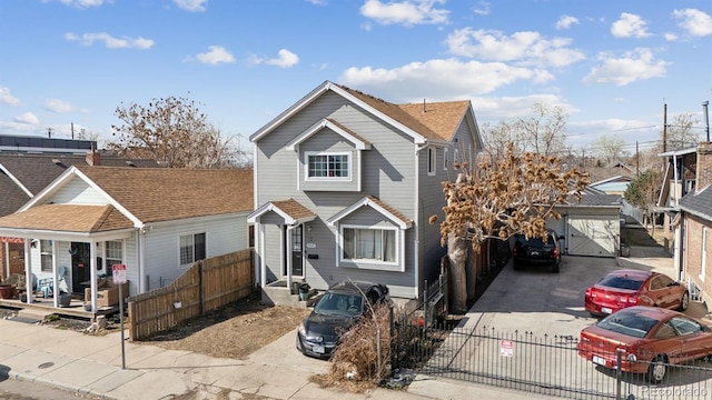 4445 Pearl St, Denver, CO 80216 - traditional-style house featuring a fenced front yard and driveway