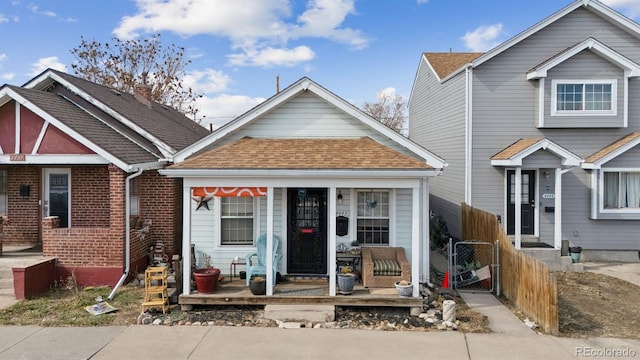4445 Pearl St, Denver, CO 80216 - view of front of property featuring a porch and roof with shingles