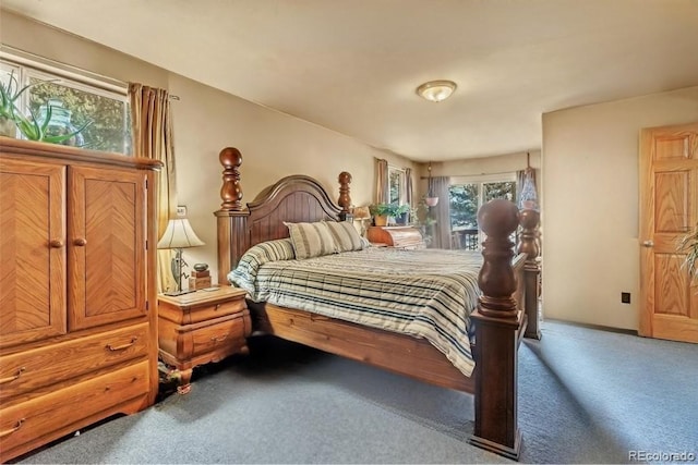 bedroom with carpet flooring and baseboards