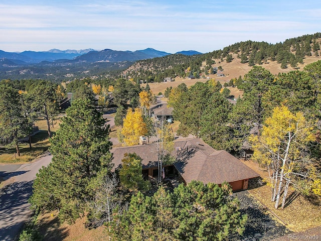 birds eye view of property with a mountain view