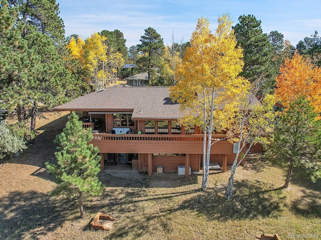 back of property featuring a patio and a yard