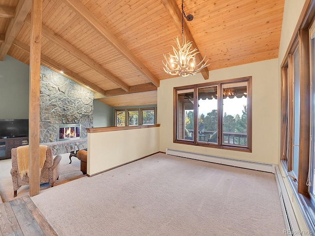 interior space with beam ceiling, a fireplace, and a healthy amount of sunlight