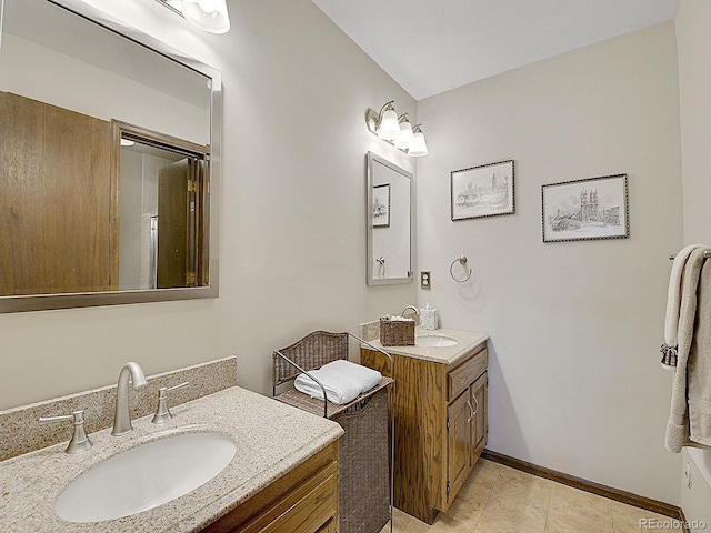 bathroom with vanity and tile patterned floors