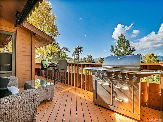 wooden terrace with grilling area