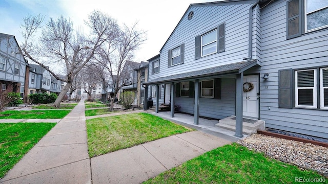 677 Vrain St Unit 15, Denver, CO 80204 - view of side of property with a residential view and a lawn