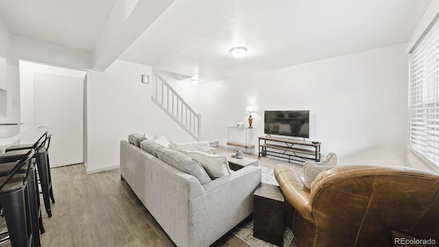 677 Vrain St Unit 15, Denver, CO 80204 - living room with stairway, light wood-style flooring, and plenty of natural light