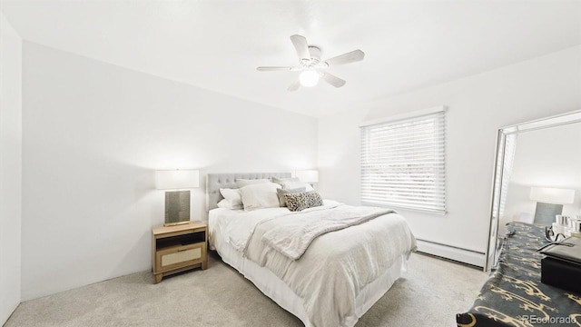 677 Vrain St Unit 15, Denver, CO 80204 - bedroom featuring baseboard heating, light carpet, and ceiling fan