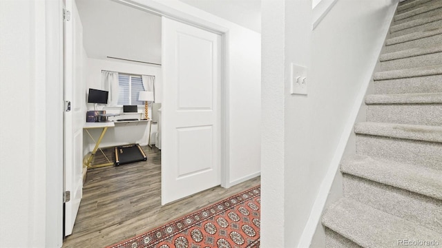677 Vrain St Unit 15, Denver, CO 80204 - stairs featuring wood finished floors and baseboards