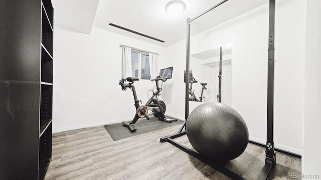 677 Vrain St Unit 15, Denver, CO 80204 - exercise room with wood finished floors and baseboards