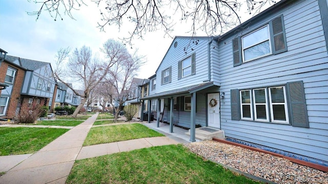 677 Vrain St Unit 15, Denver, CO 80204 - view of side of property featuring a residential view and a yard