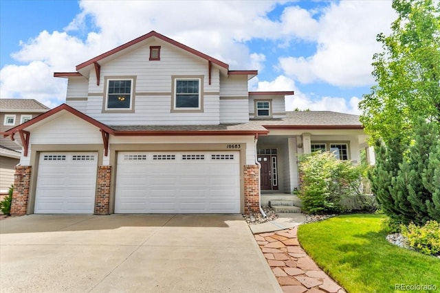 10683 Amesbury Way, Highlands Ranch, CO 80126 - view of front of home featuring brick siding, concrete driveway, and a garage