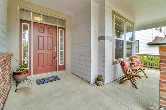 10683 Amesbury Way, Highlands Ranch, CO 80126 - doorway to property featuring covered porch