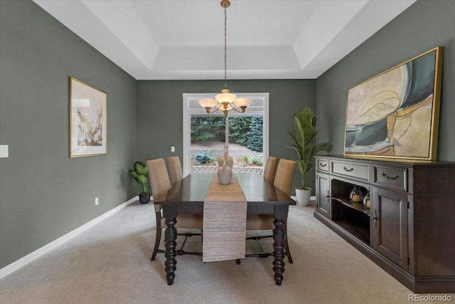 10683 Amesbury Way, Highlands Ranch, CO 80126 - dining room with a raised ceiling, a chandelier, and light colored carpet