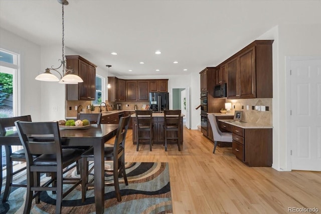 10683 Amesbury Way, Highlands Ranch, CO 80126 - dining room with light wood-type flooring and recessed lighting
