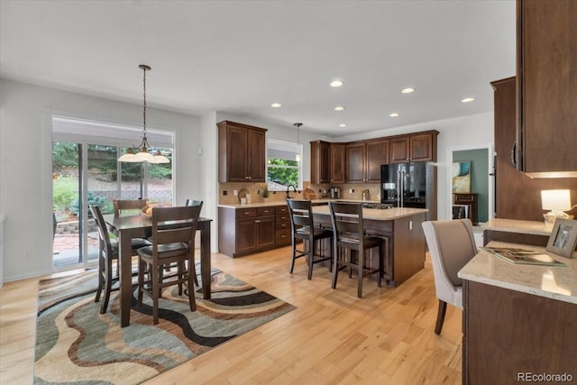 10683 Amesbury Way, Highlands Ranch, CO 80126 - dining space with recessed lighting and light wood-style floors