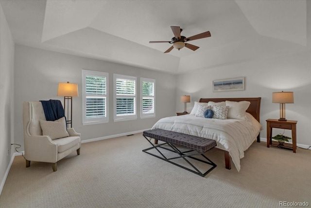 10683 Amesbury Way, Highlands Ranch, CO 80126 - bedroom featuring light colored carpet, a tray ceiling, and ceiling fan