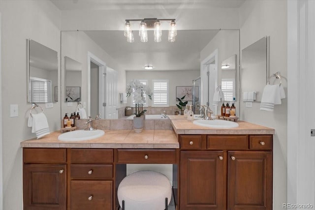 10683 Amesbury Way, Highlands Ranch, CO 80126 - full bathroom with double vanity, a stall shower, and a tub
