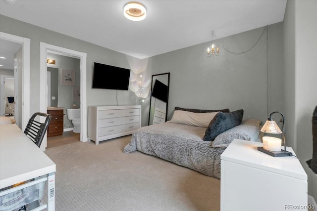 10683 Amesbury Way, Highlands Ranch, CO 80126 - bedroom with light carpet, a chandelier, and ensuite bathroom