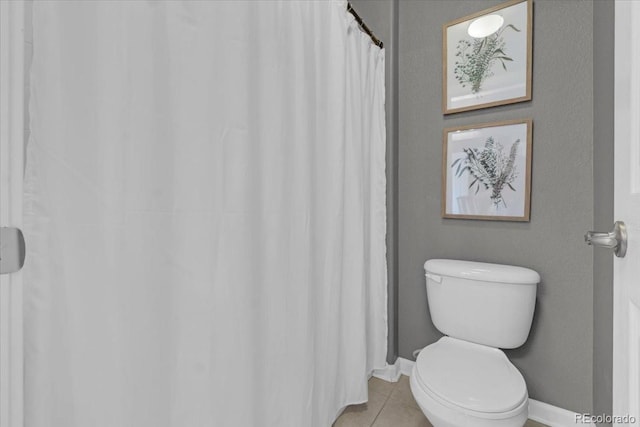 10683 Amesbury Way, Highlands Ranch, CO 80126 - full bathroom with toilet and tile patterned floors