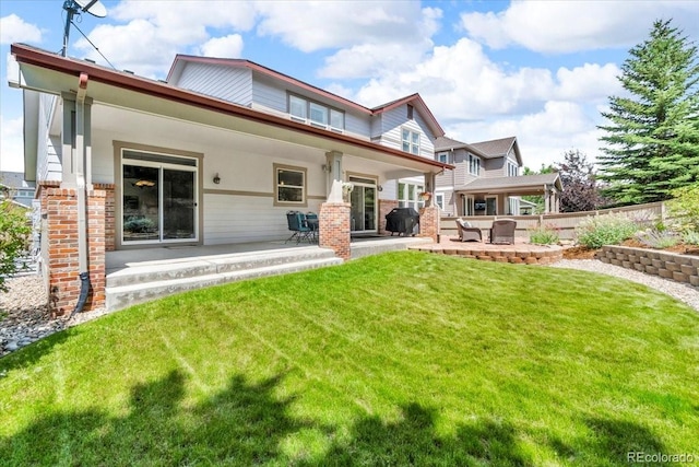 10683 Amesbury Way, Highlands Ranch, CO 80126 - back of property featuring a patio area