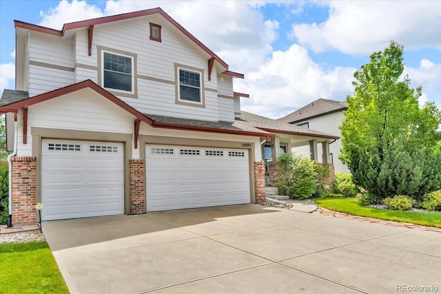 10683 Amesbury Way, Highlands Ranch, CO 80126 - view of front of house featuring brick siding, an attached garage, concrete driveway, and a shingled roof