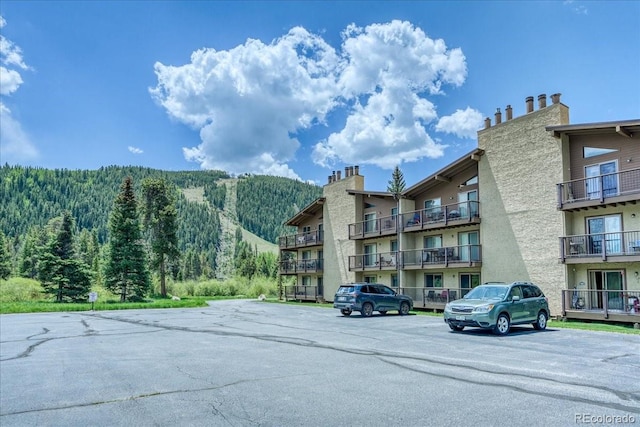 23004 US Highway 6 Unit 103, Dillon, CO 80435 - view of apartment building / complex featuring uncovered parking and a mountain view